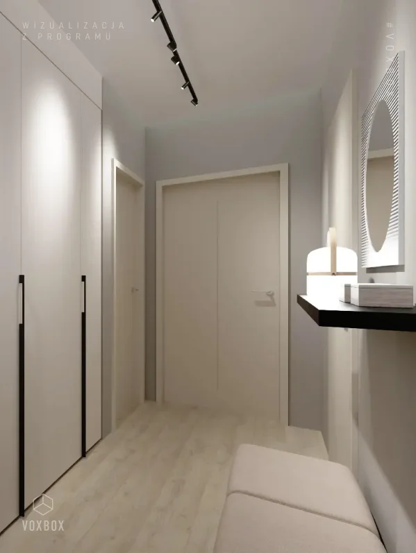 Minimalistyczny przedpokój z jasnymi meblami i oświetleniem LED.